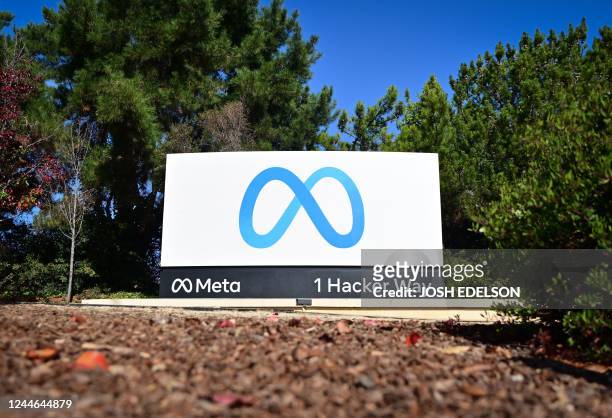 The Meta logo marks the entrance of their corporate headquarters in Menlo Park, California on November 09, 2022. - Facebook owner Meta will lay off...
