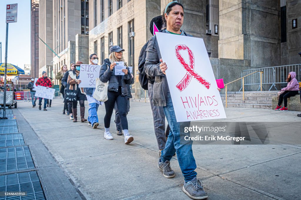 Participant seen holding a sign at the protest. Members of...