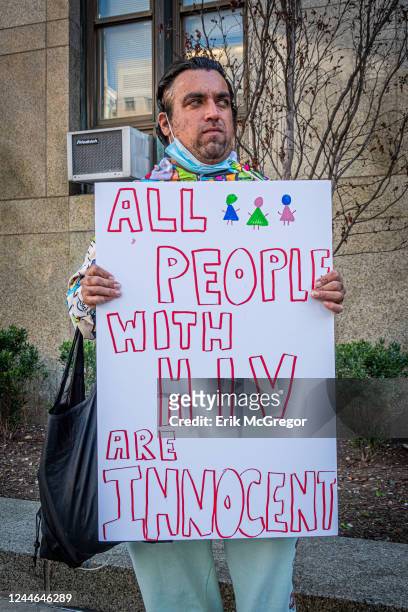 Participant seen holding a sign at the protest. Members of the AIDS Coalition To Unleash Power , Housing Works and GMHC held a protest outside the NY...