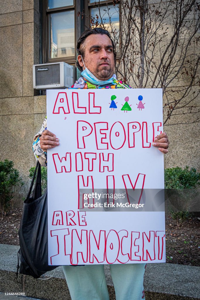 Participant seen holding a sign at the protest. Members of...