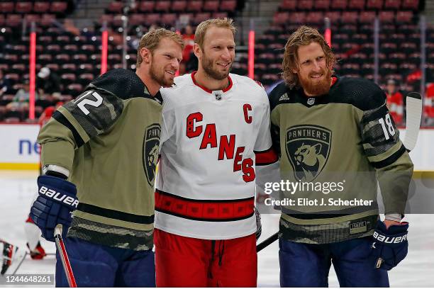 Teammates Eric Staal and Marc Staal of the Florida Panthers pose for a picture with their brother Jordan Staal of the Carolina Hurricanes prior to...