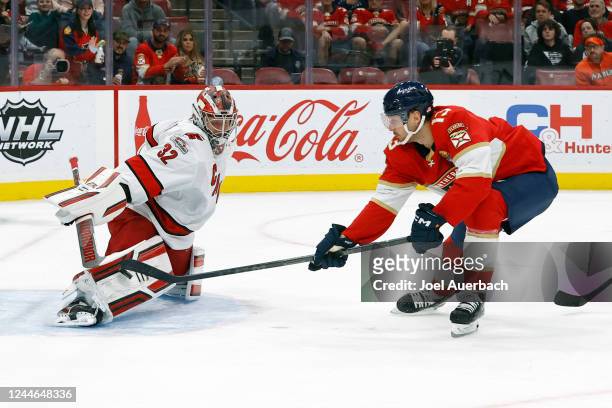 Goaltender Antti Raanta of the Carolina Hurricanes stops a shot by Sam Reinhart of the Florida Panthers at the FLA Live Arena on November 9, 2022 in...