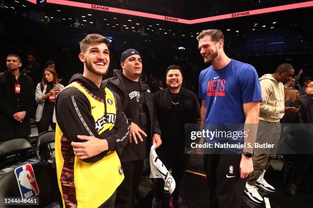 Influencers Caio Teixeira, Igão, and Miticoon talk to Assistant Coach Tiago Splitter of the Brooklyn Nets before the game against the New York Knicks...