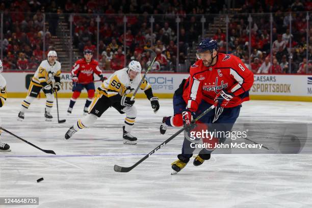 Alex Ovechkin of the Washington Capitals makes a play for the puck during a game against the Pittsburgh Penguins at Capital One Arena on November 9,...