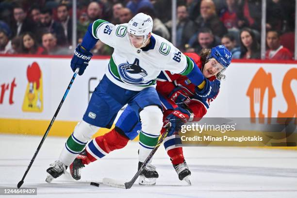 Ilya Mikheyev of the Vancouver Canucks and Michael Pezzetta of the Montreal Canadiens battle for the puck during the first period at Centre Bell on...