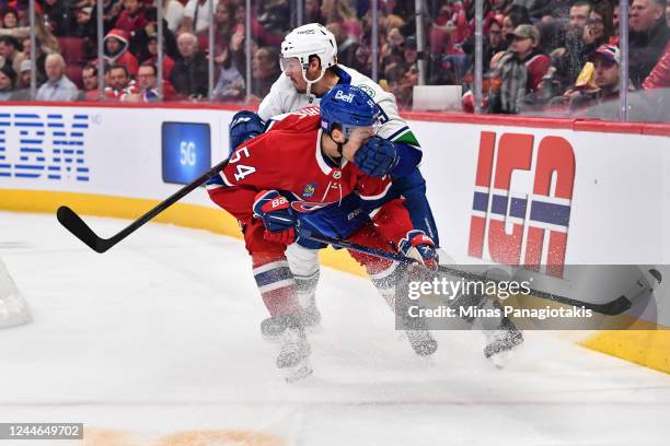 Miller of the Vancouver Canucks facepalms Jordan Harris of the Montreal Canadiens during the first period at Centre Bell on November 9, 2022 in...