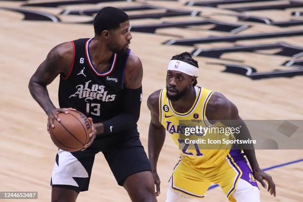 Clippers guard Paul George guarded by Los Angeles Lakers guard Patrick Beverley during the NBA game between the Los Angeles Lakers and the Los...