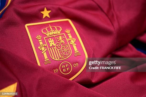 Picture taken on November 8, 2022 in Paris, shows the logo on a jersey of the Spain national football team for the Football FIFA World Cup 2022 in...