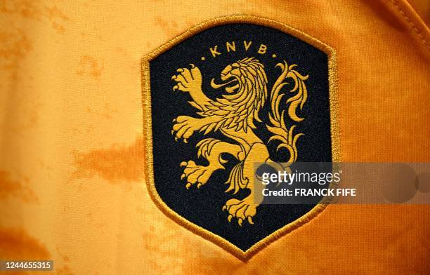 Picture taken on November 8, 2022 in Paris, shows the logo on a jersey of the Netherlands' national football team for the Football FIFA World Cup...