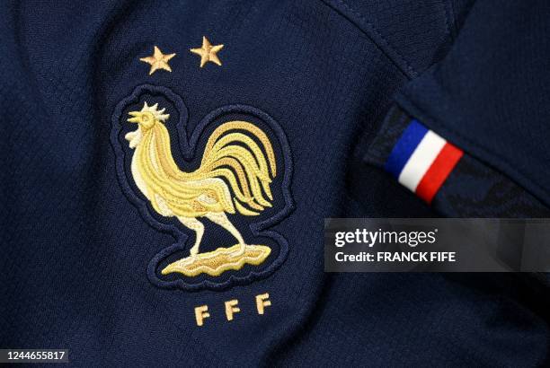 Picture taken on November 8, 2022 in Paris, shows the logo on a jersey of the France national football team for the Football FIFA World Cup 2022 in...