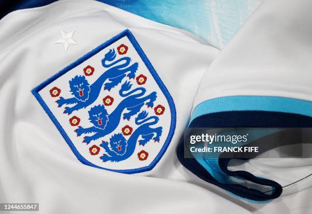 Picture taken on November 8, 2022 in Paris, shows the logo on a jersey of the England national football team for the Football FIFA World Cup 2022 in...