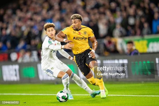 Wolvess Adama Traore and Mateo Joseph of Leeds during the Carabao Cup match between Wolverhampton Wanderers and Leeds United at Molineux,...