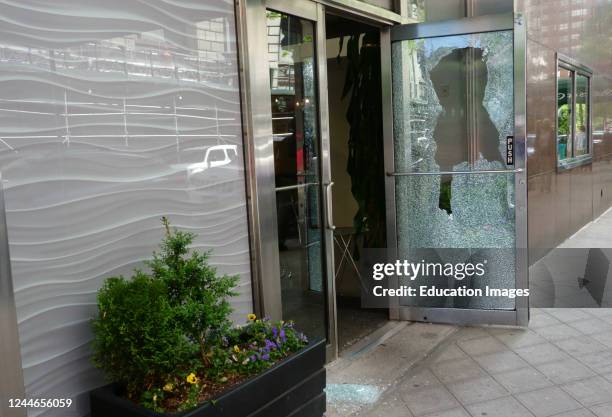 Smashed store front following looting after protests over George Floyd's death.