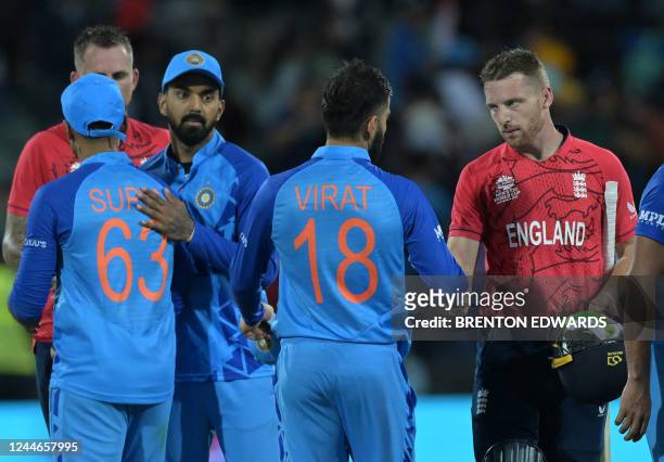 England's Captain Jos Buttler shakes hands with India's Virat Kohli as he celebrates after victory in the ICC men's Twenty20 World Cup 2022...