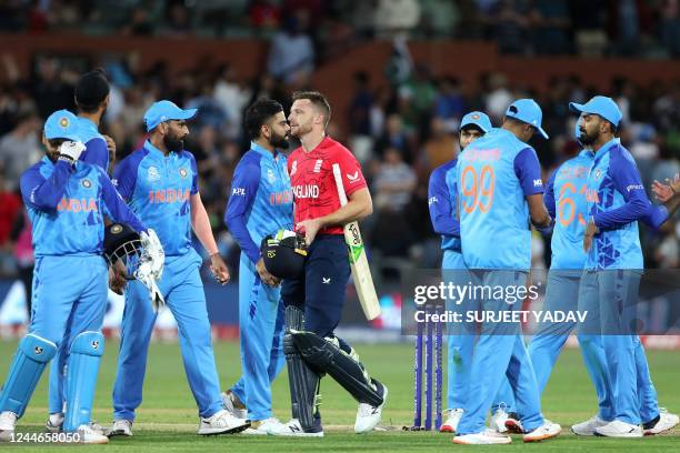 England's Captain Jos Buttler walks off the field after their win during the ICC men's Twenty20 World Cup 2022 semi-final cricket match between...