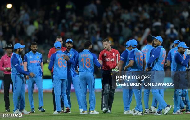 England's Captain Jos Buttler shakes hands with India's Virat Kohli as he celebrates after victory in the ICC men's Twenty20 World Cup 2022...