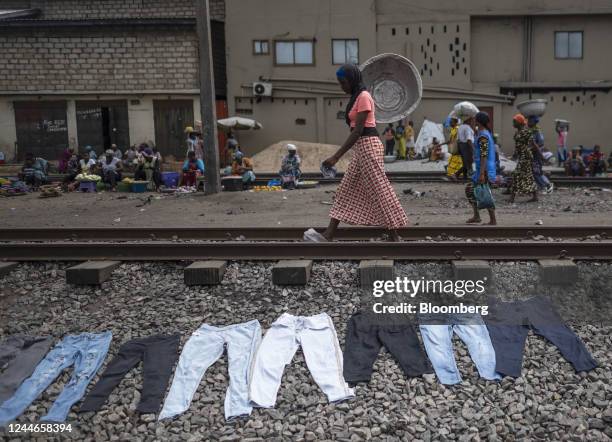 Second-hand jeans lay on the ground to dry after starching ahead of resale at the Kantamanto textile market in Accra, Ghana, on Friday, Sept. 16,...