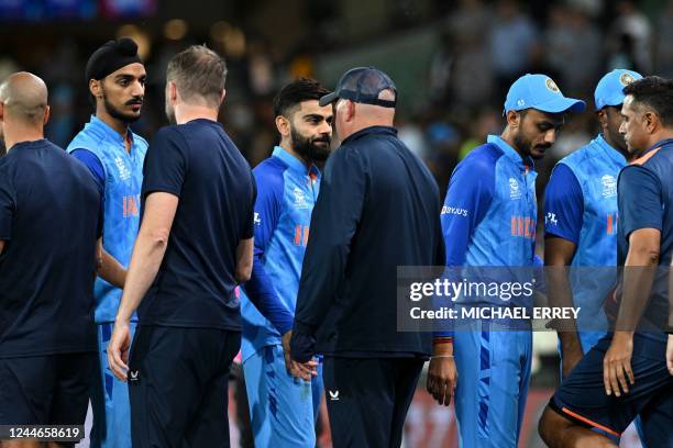 Indian players shake hands with England team after the ICC men's Twenty20 World Cup 2022 semi-final cricket match between England and India at The...