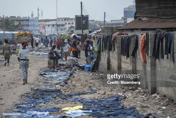 Second-hand jeans lay on the ground to dry ahead of resale at the Kantamanto textile market in Accra, Ghana, on Friday, Sept. 16, 2022. The rise of...