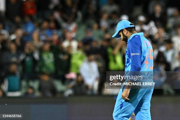 India's Captain Rohit Sharma walks off the field after the ICC men's Twenty20 World Cup 2022 semi-final cricket match between England and India at...