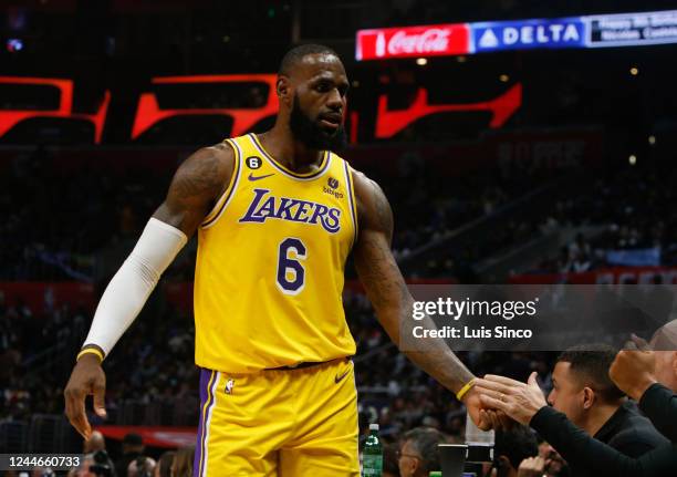 Lakers forward LeBron James heads to the bench for a breather in the second quarter of the game against the Clippers at Crypto.com Arena in Los...