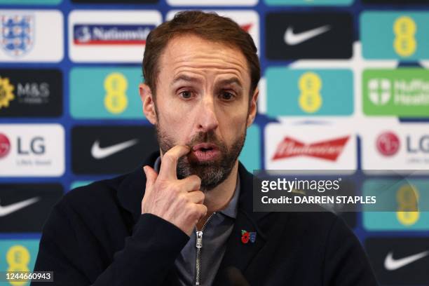 England's manager Gareth Southgate gestures during a press conference at St George's Park in Burton-on-Trent after revealing the England squad for...