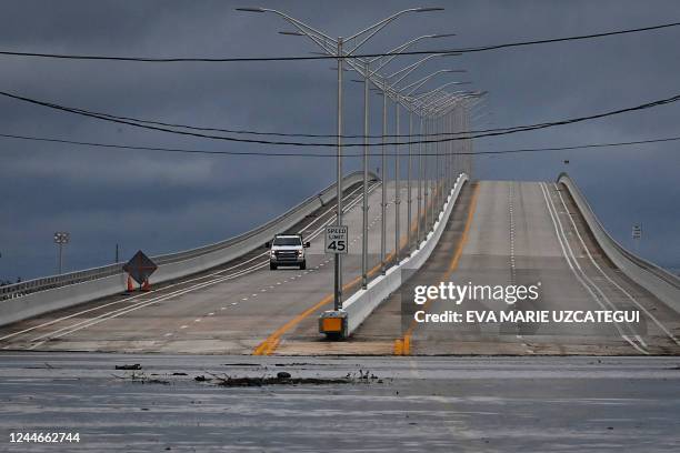 Partially flooded street impedes access to a bridge after Hurricane Nicole's landfall, in Vero Beach, Florida, on November 10, 2022. - Tropical Storm...