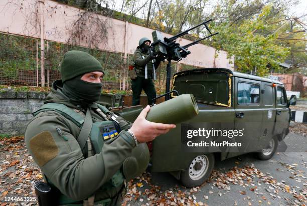 Ukrainian servicemen of National Guard operate with a homemade anti-aircraft machine gun to destroy drones presented in Mykolaiv, Ukraine 9 November...