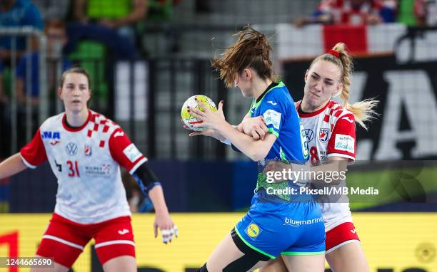Ana Gros of Slovenia is challenged by Kristina Prkacin of Croatia during EHF European Women's Handball Championship match between Croatia and...