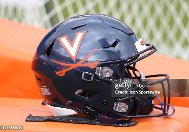 Virginia Cavaliers helmet with logo resting on the sidelines during a college football game between the North Carolina Tar Heels and the Virginia...