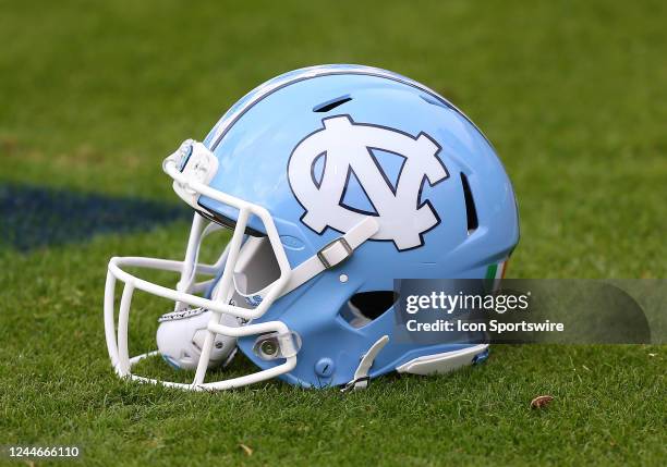 North Carolina Tar Heels helmet resting on the field during pregame drills prior to a college football game between the North Carolina Tar Heels and...