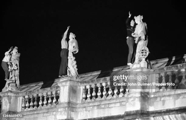 Students night climbing on one of the historic buildings at Cambridge University, England, circa June 1959. Night climbing describes the pursuit of...