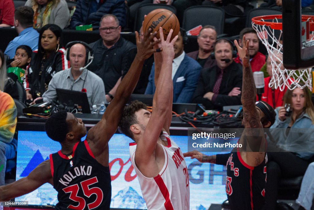Houston Rockets Toronto Raptors Christian Koloko of the Toronto Raptors knocks out the ball from ...