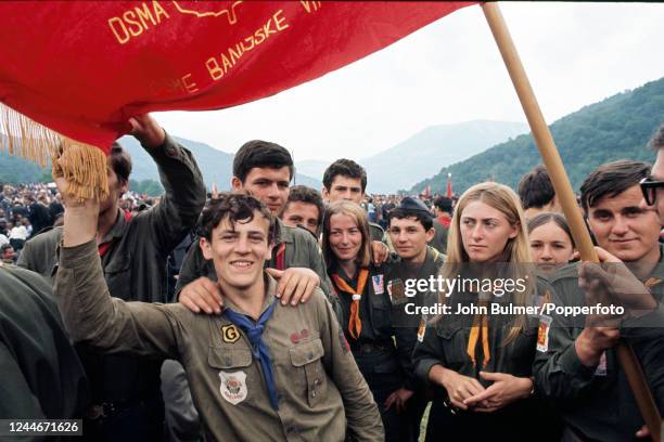 Group of young people celebrate with thousands of veterans of Marshal Tito's partisan army who gathered for the 25th anniversary of the most...