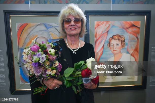 Artist Barbara Kaczmarowska-Hamilton stands next to a portrait of Stefania Zahorska, pseudonym Pandora, a Polish art historian. On the eve of...