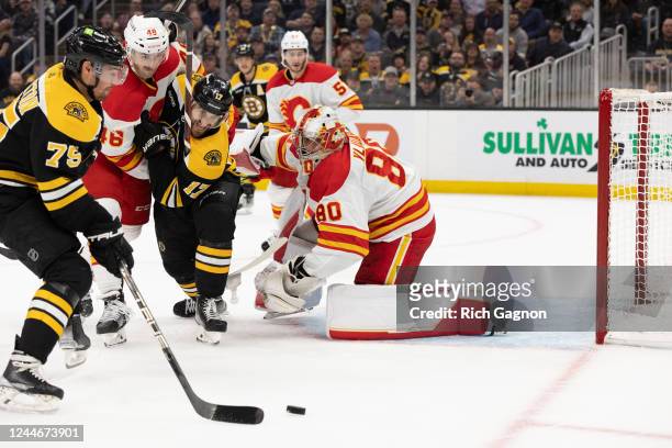 Connor Clifton of the Boston Bruins scores a goal against Dan Vladar of the Calgary Flames during the first period at the TD Garden on November 10,...