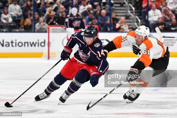 Gustav Nyquist of the Columbus Blue Jackets skates with the puck while Justin Braun of the Philadelphia Flyers defends during the first period of a...