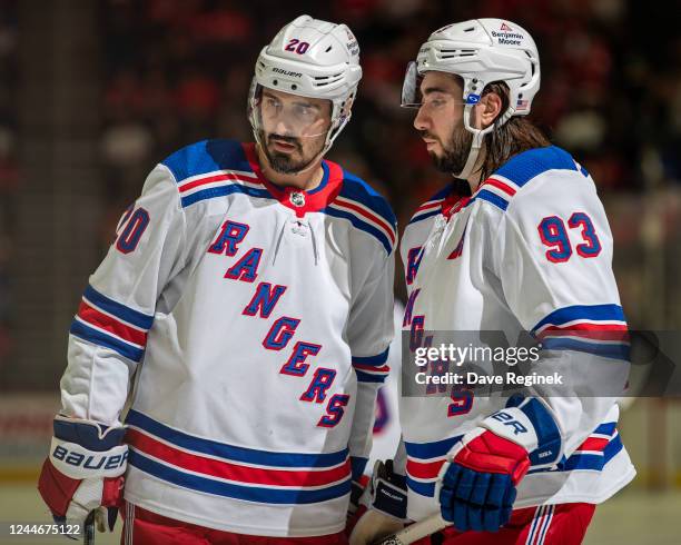 Chris Kreider and Mika Zibanejad of the New York Rangers talk during a stoppage in play in the second period of an NHL game against the Detroit Red...