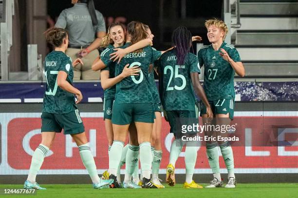 Paulina Krumbiegel of Germany is congratulated by her teammates after scoring a goal in the second half of the women's international friendly game...