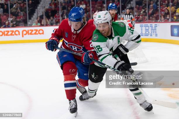 Kaiden Guhle of the Montreal Canadiens defends against Joe Pavelski of the Dallas Stars during the third period in the NHL game against at the Centre...