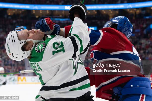 Arber Xhekaj of the Montreal Canadiens collides with Ty Dellandrea of the Dallas Stars during the first period in the NHL game at the Centre Bell on...