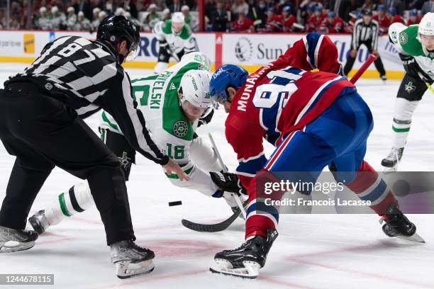 Sean Monahan of the Montreal Canadiens faces off against Joe Pavelski of the Dallas Stars during the second period in the NHL game at the Centre Bell...