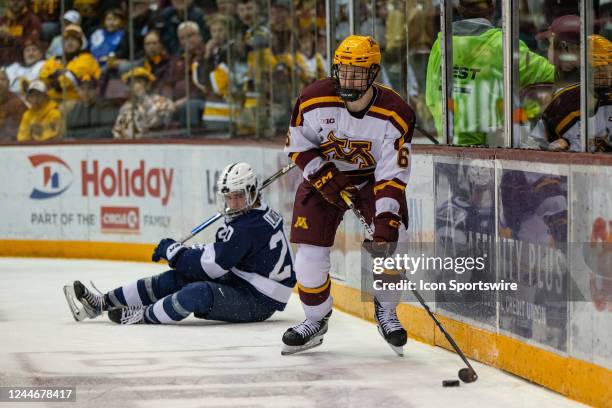 Minnesota defenseman Cal Thomas skates with the puck during the college hockey game between the Penn State Nittany Lions and the Minnesota Gophers on...