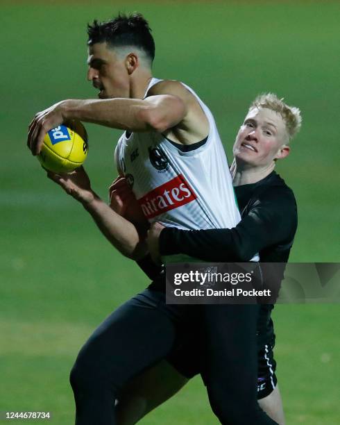 Scott Pendlebury is tackled by John Noble of the Magpies during a Collingwood Magpies AFL training session at Holden Centre on June 04, 2020 in...