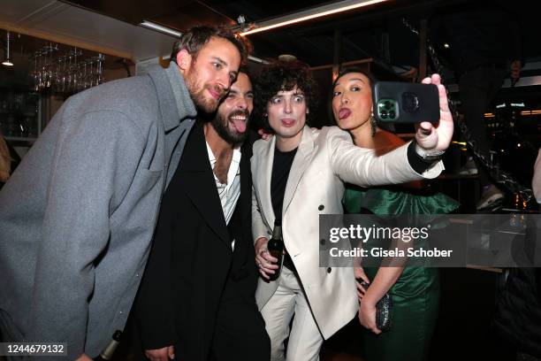 Jonas Bloquet, Jose Pimentao, Aneurin Barnard and Gabby Wong make a selfie prior the screening of the Netflix series "1899" at Funkhaus Berlin on...