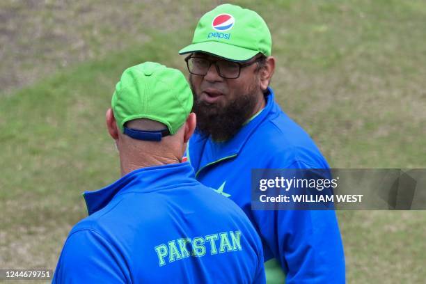 Pakistan coach Saqlain Mushtaq speaks with batting coach Matthew Hayden during a training session in Melbourne on November 11 ahead of their ICC...