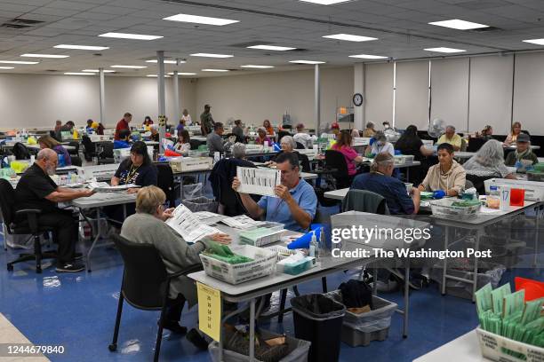 Election workers process ballots at the Maricopa County Tabulation and Election Center on November 10, 2022 in Phoenix, Arizona. Over a hundred...