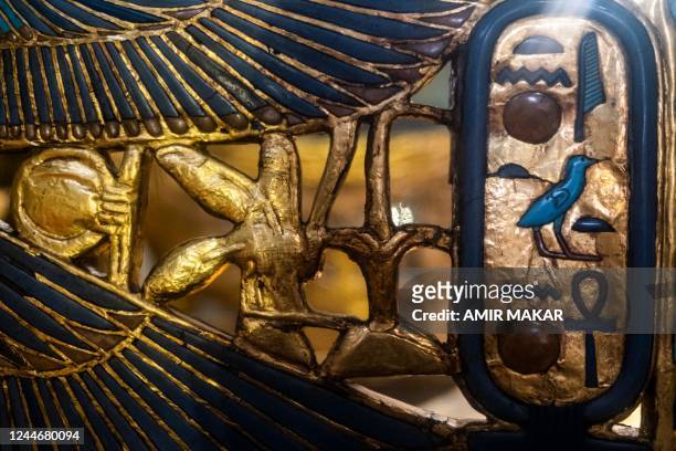 The old birthname cartouche of the ancient Egyptian the New Kingdom Pharaoh Tutankhamun , is displayed on his gilded chair found at his tomb KV62,...