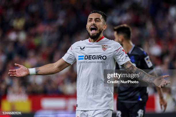 Alex Telles of Sevilla FC argue with referee during the La Liga Santader match between Sevilla CF and Real Sociedad at Ramon Sanchez Pizjuan in...