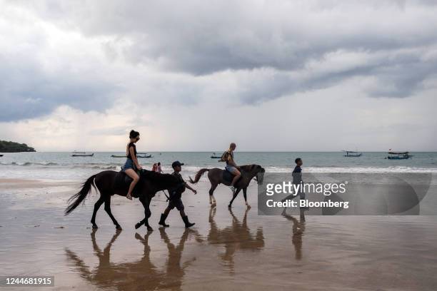 Tourists ride horses at Jimbaran beach in Bali, Indonesia, on Thursday, Nov. 10, 2022. The G-20 summit, which will be held Nov. 15-16 at Nusa Dua, is...